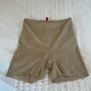 Tan spanx shorts.